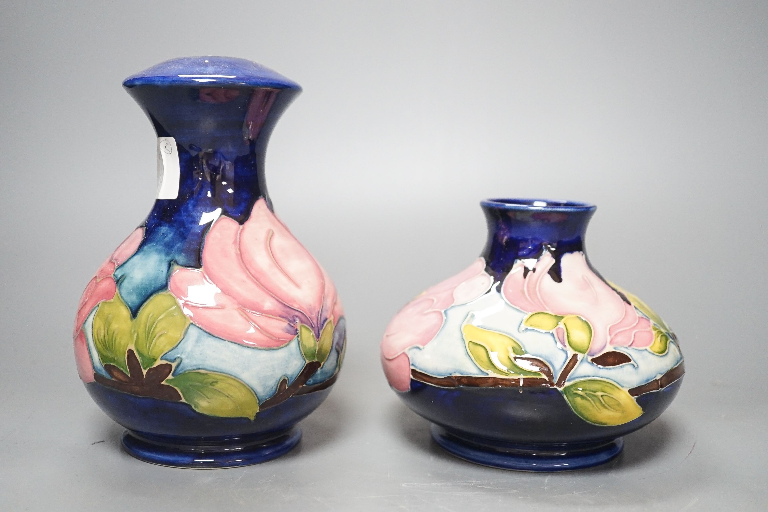 Two Moorcroft magnolia pattern vases 17cm